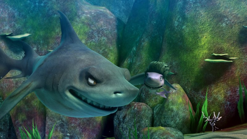 Der böse Hai Troy ist aus einer Forschungsstation der Marine ausgebrochen und macht sich auf den Weg zum Riff, dessen Bewohner nun fürchten müssen, als schmackhafte Beute zu enden. – Bild: SUPER RTL