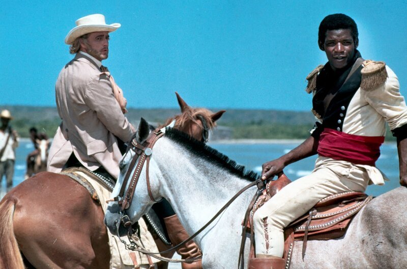 William Walker (Marlon Brando, li.) bildet den charismatischen Sklaven José Dolores (Evaristo Marquez, re.) zum Anführer der Sklavenbewegung aus. – Bild: arte