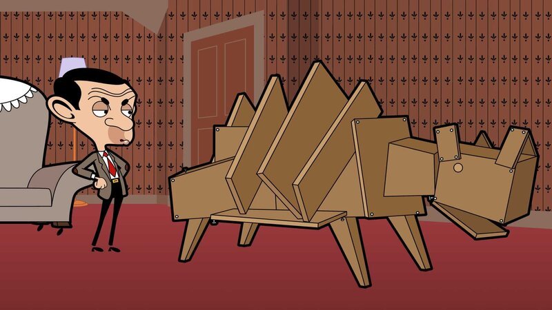 Mr. Bean begutachtet kritisch seinen selbst zusammengebauten Dinosaurier. – Bild: Boomerang (DE) /​ Tiger Aspect Productions 2014 Ltd