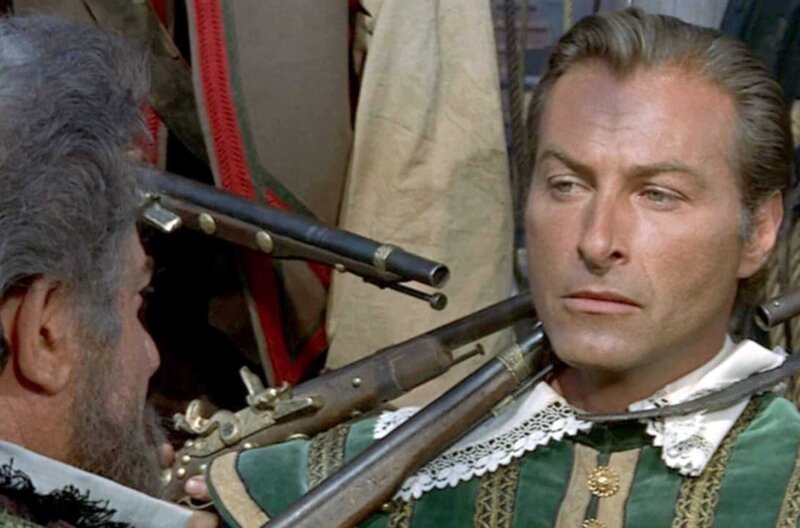 Die Küste der Piraten – Bild: 2023 Plaion Pictures/​All rights reserved /​ Das Schiff von Kapitän Monterrey (Lex Barker, re.) wird auf dem Weg nach Spanien von Piraten geentert. Monterrey wurde verraten.