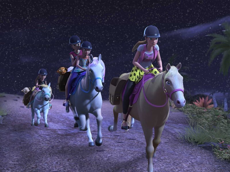 Barbie (vorne) und ihre Schwestern machen gemeinsam mit ihren Welpen und den Pferden einen nächtlichen Ausritt, begleitet von den leuchtenden Sternen am Himmel. – Bild: Universal Studios Inc.