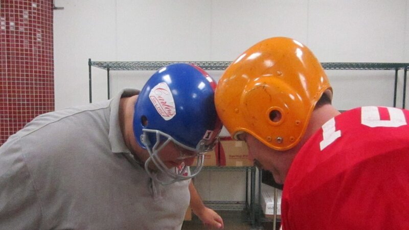 Frankie and Danny knock heads while dressed in football gear. – Bild: Discovery Communications/​Carlin Cwik/​Carlin Cwik