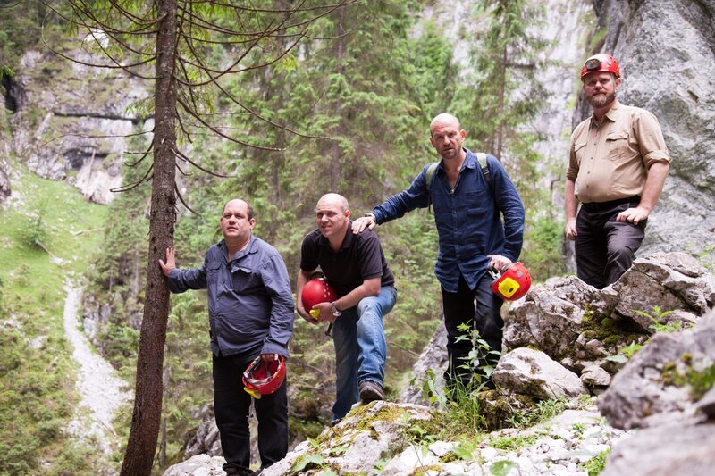 The Rock Raiders holding helmets while trekking to the caves in the Apuseni Mountains. – Bild: Copyright: Discovery Communications, Inc. For Show Promotion Only