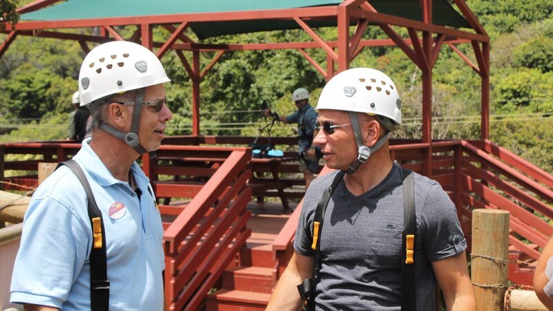 Host Anthony Melchiorri talks to GM Michael before getting on zipline, as seen on Travel Channel’s Hotel Impossible. – Bild: 2012, The Travel Channel, L.L.C. All rights Reserved.