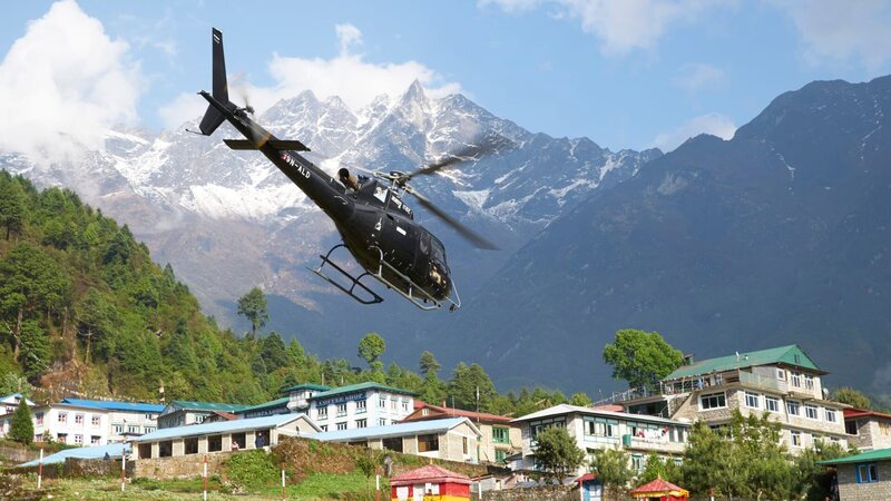 Manang Helicopter leaving the helipad and flying over Lukla airport. Lukla, Nepal. – Bild: Discovery Communications.