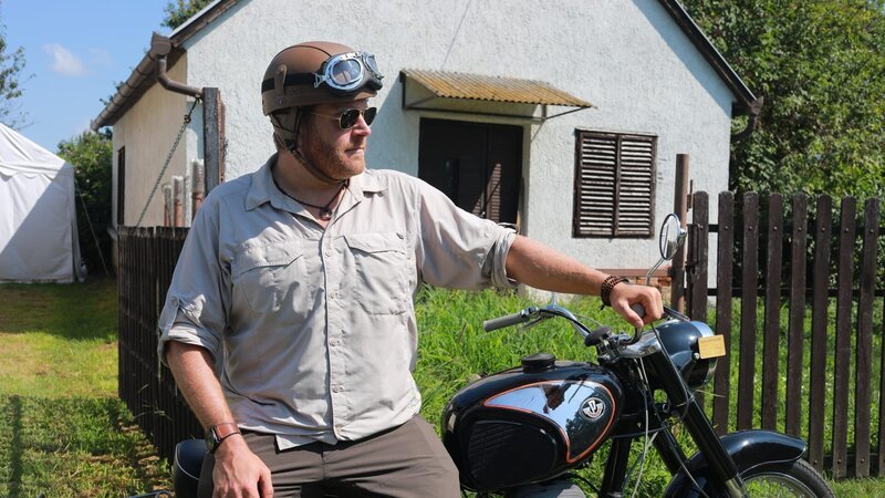 Josh Gates on his motorcycle in the Hungarian countryside. – Bild: Discovery Channel /​ Discovery Communications, LLC