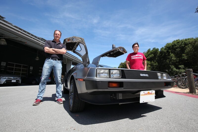 Two of the creators of Marty, Prof. Chris Gerdes and Jon Goh, stand by the car. – Bild: Science Comm /​ Discovery Communications