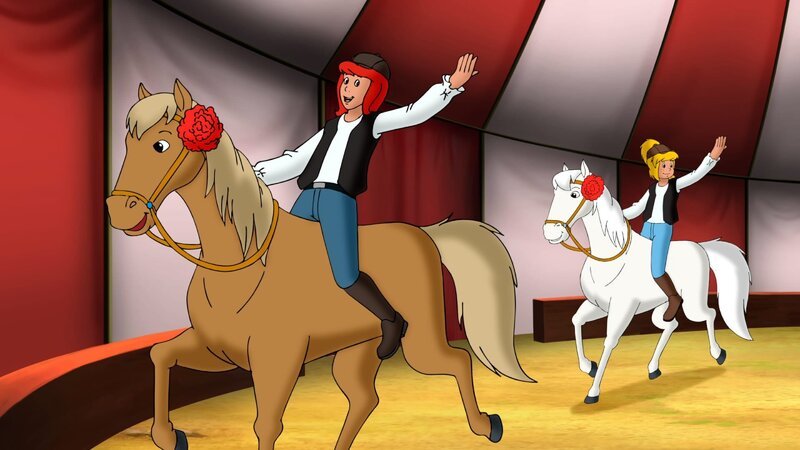Tina (l.) und Bibi (r.) springen beherzt als Ersatznummer im Zirkus Magnus ein und zeigen ihre Reitkünste. – Bild: Kiddinx – Berlin