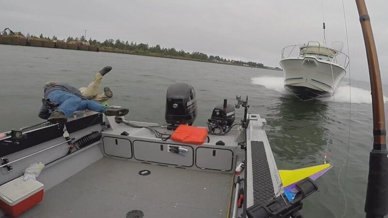 Chris McMahon and Roni jumping off the side of the boat as second boat collides – Bild: Lion Television, LLC.