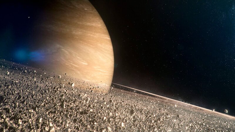 Saturn’s rings are made up of countless particles. – Bild: BBC/​Brian Cox/​Created by Lola Post Production
