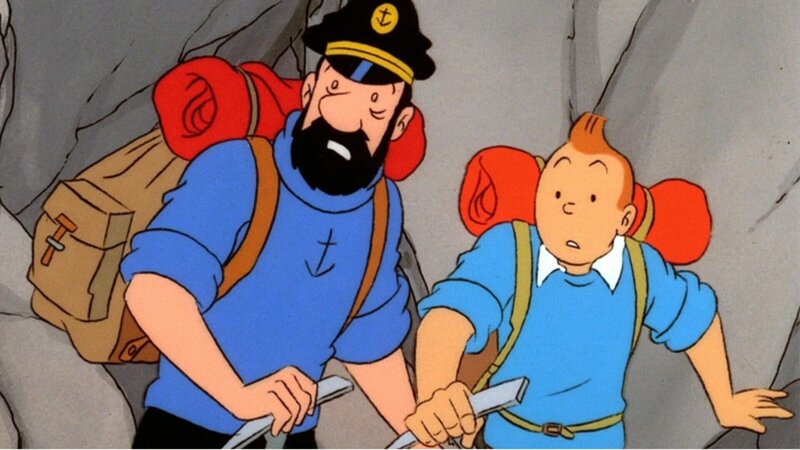 Tim (r.) und Kapitän Haddock (l.) suchen in den Bergen nach einem Freund, der bei einem Flugzeugabsturz ums Leben gekommen sein soll. Doch dann machen sie eine ungewöhnliche Entdeckung. – Bild: Ellipsanime/​France 3/​M6/​Nelvana