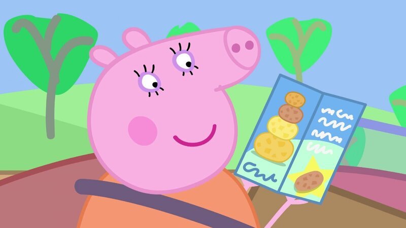 Mama Wutz erklärt Peppa was die Kartoffeltraumstadt ist. – Bild: SUPER RTL