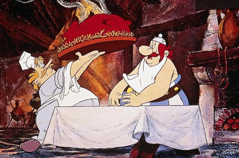 Waehrend Asterix damit beschaeftigt ist, Rom zu erobern, erobert Obelix das herz eines Kochs, der ihn mit Leckereien versorgt. – Bild: ORF 1