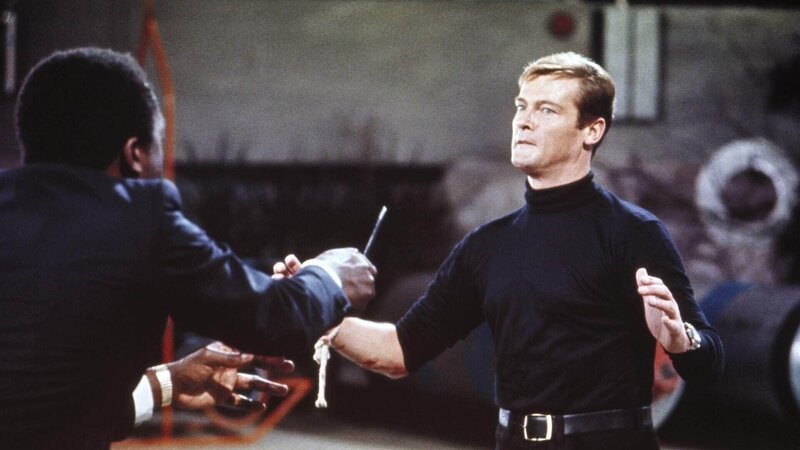 Kananga/​Big (Yaphet Kotto, l.), James Bond (Roger Moore) – Bild: TVNOW /​ Danjaq, LLC and Metro-Goldwyn-Mayer Studios Inc.