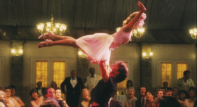 Johny Castle (Patrick Swayze) und Baby Houseman (Jennifer Grey) – Bild: OTCM Johny Castle (Patrick Swayze) und Baby Houseman (Jennifer Grey) – Bild: OTCM