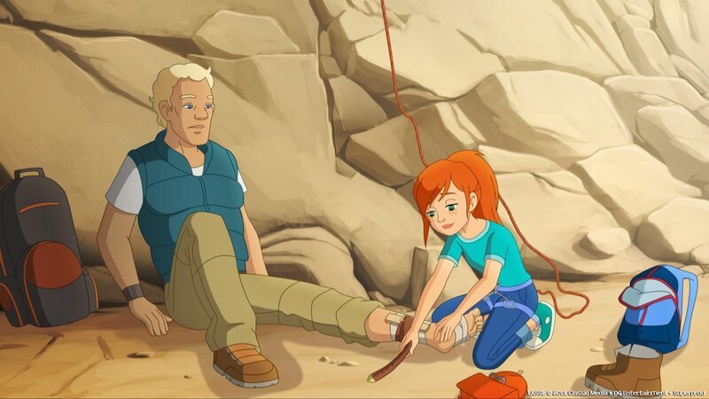Zoé verarztet einen verletzten Kletterer, der sich den Knöchel gebrochen hat. – Bild: ZDF/​Classic Media/​DC Entertainment/​Superprod
