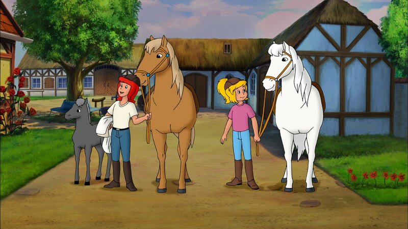 Bibi (r.) und Tina (l.) wollen zur Gruselparty in die Wolfsschlucht reiten. Für ihre Pferde haben sie weiße Umhänge dabei. – Bild: ZDF