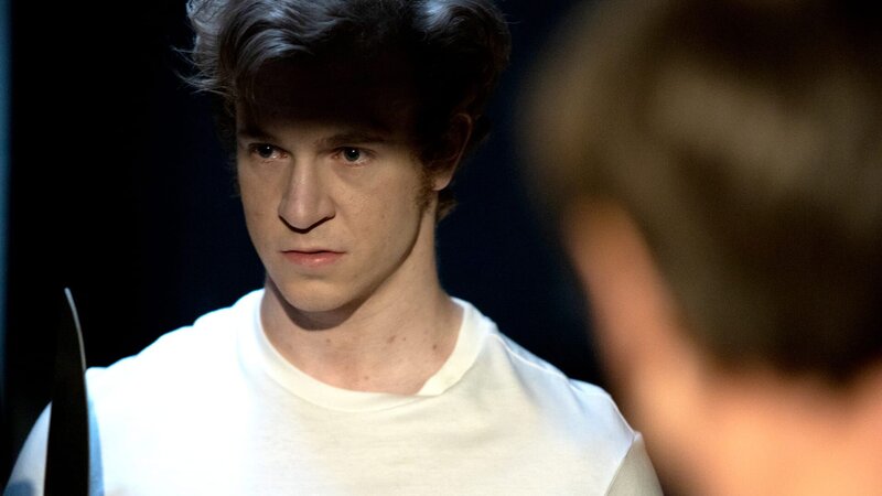 Schuler (Harry Lester) holding a big knife his father watches – Bild: Drive Media Rights Limited