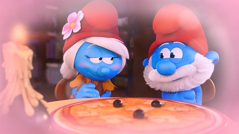 Träumer Schlumpf glaubt an die große Liebe und wettet mit Muffi, dass sich Papa Schlumpf und Schlumpfhilde ineinander verlieben werden. – Bild: KiKA/​Peyo Productions, Dupuis Édition & Audiovisuell