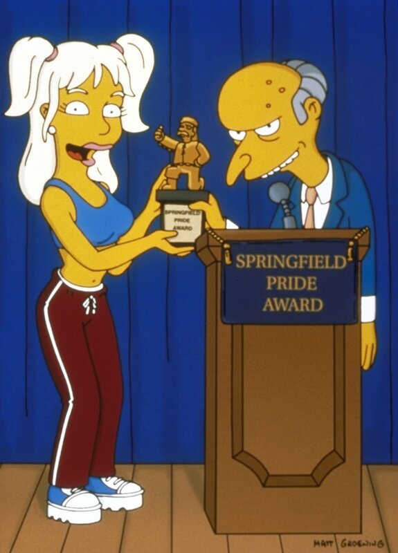 Britney Spears (l.) überreicht Mr. Burns (r.) einen Ehrenpreis der Stadt Springfield. – Bild: Twenthieth Century Fox Film Corporation