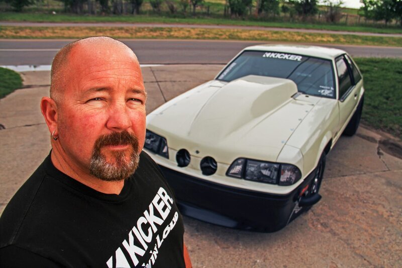 Chuck standing in front of his car in the driveway. – Bild: Discovery Channel /​ Discovery Communications