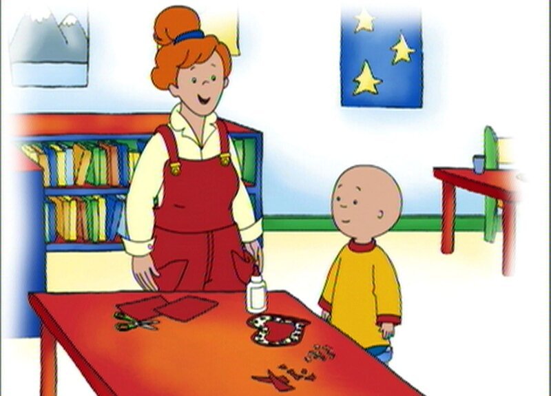 Miss Martin hilft Caillou, der eine neue Valentinskarte für Leo basteln möchte. – Bild: SUPER RTL
