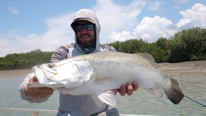 Brian Jill poses with a Barramundi he caught in Australia. – Bild: Discovery Communications, LLC