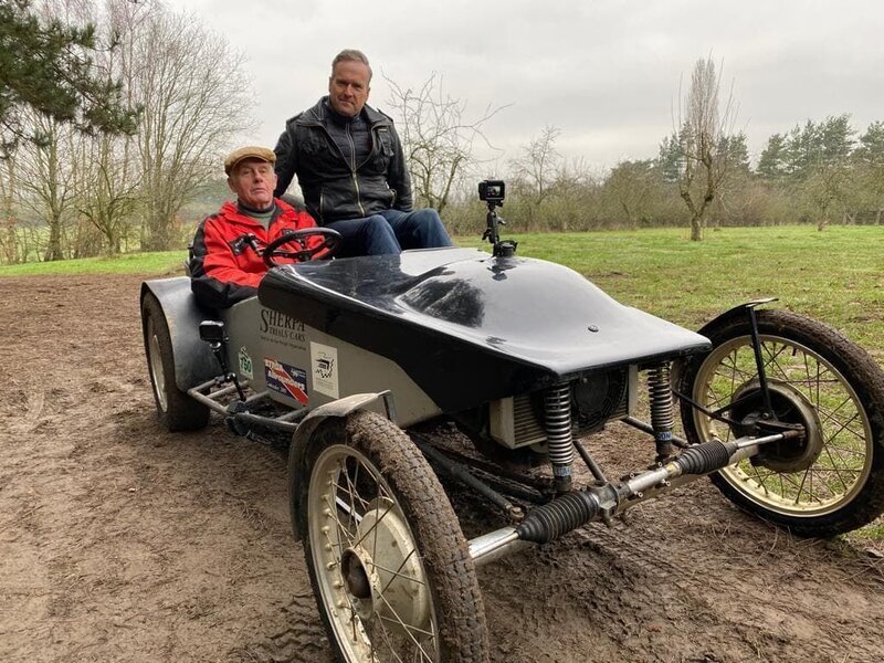 Tim sits with Martyn Halliday in his trail car at Clubman’s Historic Sporting Trial. – Bild: Disney+