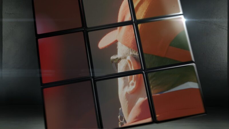 A Rubik’s cube with a football coach superimposed. – Bild: NGT