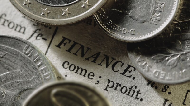 Definition of finance under coins. – Bild: National Geographic