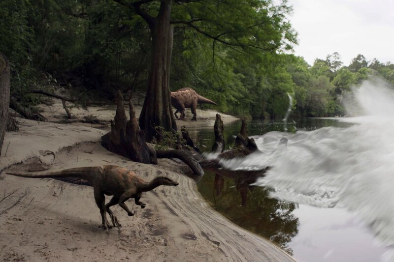Landschaft VFX Bild von Dinosauriers auf der Sandbank von Tanis, während sich eine riesige Brandungswelle nähert. – Bild: BBC Studios