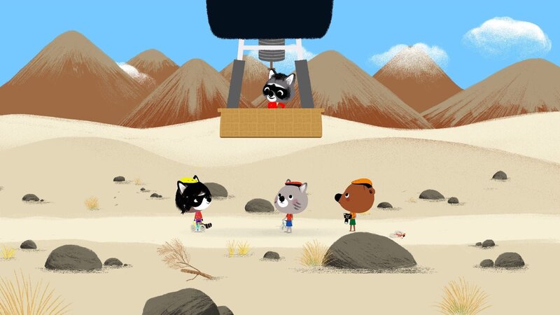 Mouk und Chavapa wollen sich die berühmten Nazca-Linien aus der Luft ansehen. Doch als Flora sie zu einem Felsen führen will, von dem aus man die Bodenbilder sehen kann, hat Chavapa einen Platten. Zum Glück kommt Floras Onkel Ricardo mit seinem Heißluftballon vorbei und nimmt die drei an Bord. – Bild: KiKA/​Millimages