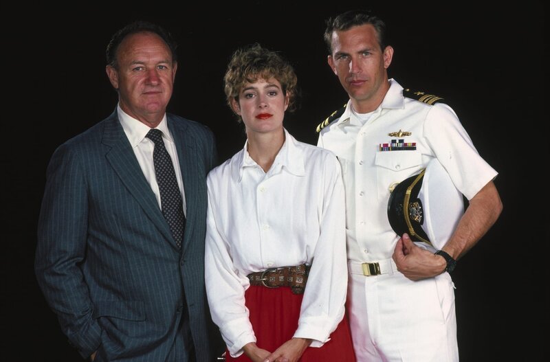 L-R: David Brice (Gene Hackman), Susan Atwell (Sean Young) und Tom Farrell (Kevin Costner) – Bild: TMG L-R: David Brice (Gene Hackman), Susan Atwell (Sean Young) und Tom Farrell (Kevin Costner) – Bild: TMG