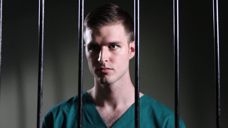 Recre- Larry Ranes looking through jail cell bars. – Bild: Discovery Communications