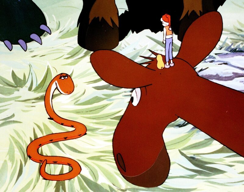 Graufell, Nils und Krümel hören sich die scheinbar freundliche Natter Hilflos an. – Bild: ORF/​Apollo Filmverleih