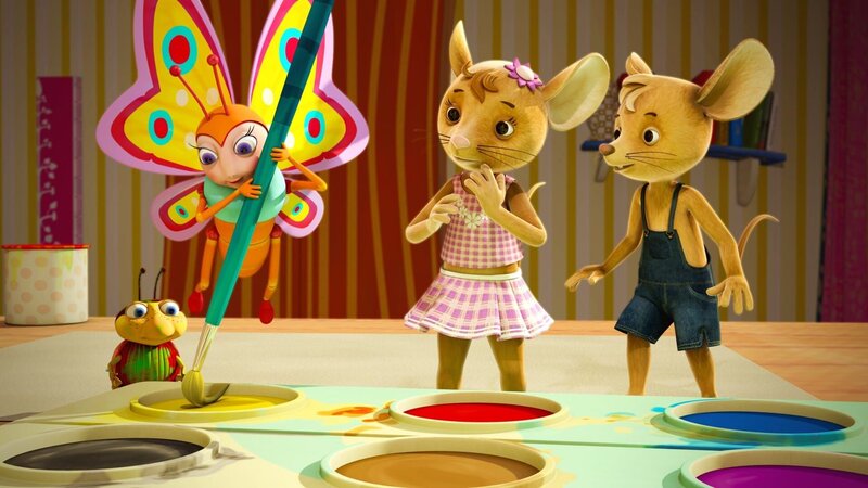 Sibel ist eine richtige Künstlerin. Sie zaubert aus Gelb und Blau das fehlende Grün! Die JoNaLus schauen bewundernd zu. – Bild: KiKA