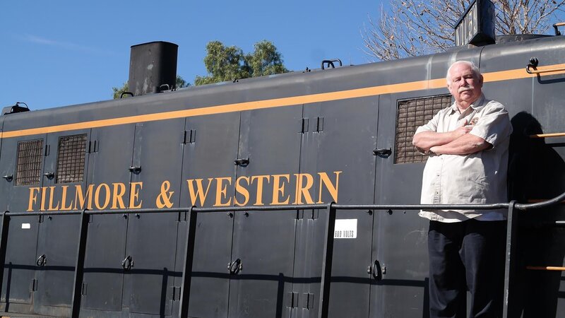 Dave, owner of Fillmore and Western Railway, in Fillmore, Calif., stands outside on train car, as seen on Food Network’s Mystery Diners, Season 9. – Bild: Television Food Network, G.P.