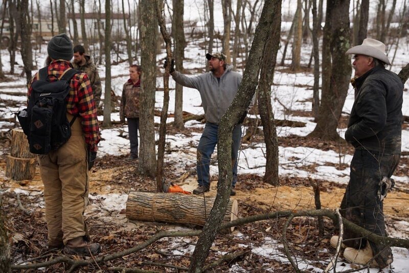 Matt Raney (backpack), Herbie Junior Russell, Florence Russell, Herb Senior Russell and Marty Raney in the forest , Marty sets the Russell a Wood Challenge near the Russell Family Homestead in Bedford, Pennsylvania. – Bild: Discovery Channel /​ Discovery Communications