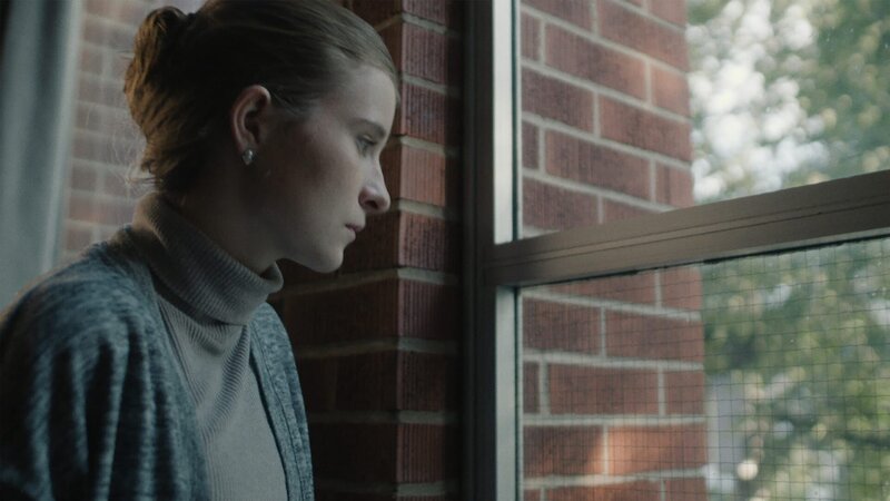 A woman looks out the window. – Bild: Blue Ant Media