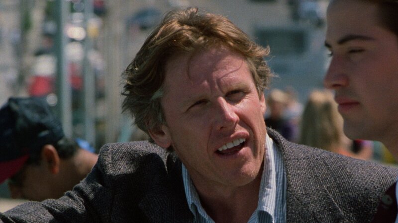 Angelo Pappas (Gary Busey) und Johnny Utah (Keanu Reeves) – Bild: KinoweltTV Angelo Pappas (Gary Busey) und Johnny Utah (Keanu Reeves) – Bild: KinoweltTV