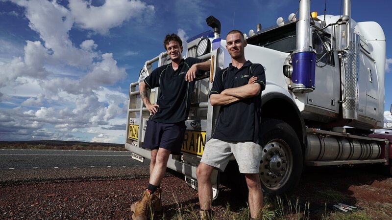Harrison Hooper and Brad Ines with their trucks – Bild: Production Company /​ Prospero Productions