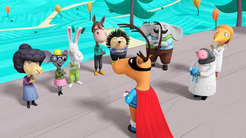 Super-Edgar steht den klatschenden Bewohnern von Windhausen gegenüber. – Bild: NDR/​France Télévisions Distribution