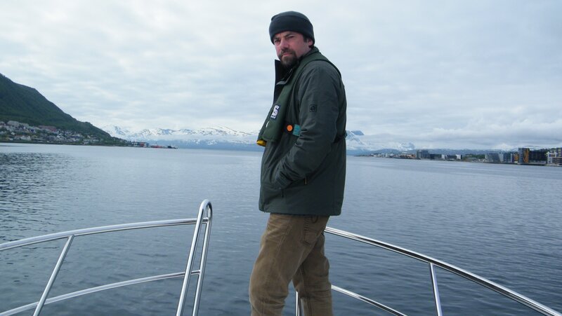 TROMSO, NORWAY – Tony Pollard at the bow of a ship. Tony is on the way to the location where the remains of the Tirpitz rests – Bild: The National Geographic Channel