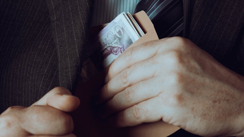 Corporate greed and corruption – Bild: Getty Images/​MachineHeadz