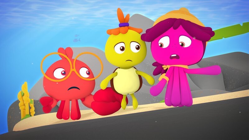 Fin, Tuts und Maari (von links nach rechts) stehen besorgt vor der tiefen Abgrundschlucht. – Bild: KiKA/​Bigchild Entertainment