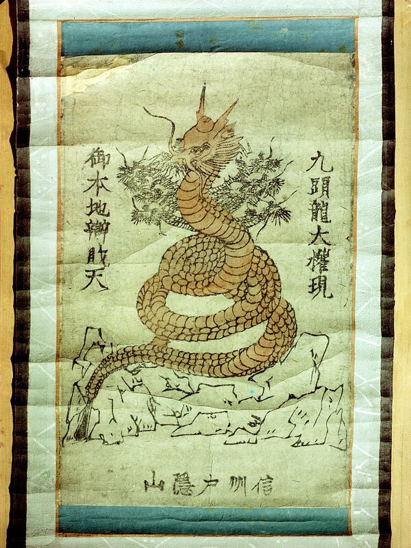 Buddhist picture of a dragon; It has been mounted on paper with mica ornaments and hand-coloured in vermilion red. In Japanese mythology the dragon (ryujin) is associated with the watery realm. Country of Origin: Japan. Culture: Japanese. Place of Origin: Shuin Monastery, Shinano Province. Material/​Size: 33 x 21 cm /​ JHloucha Collection, Prague. – Bild: www.bridgemanart.com