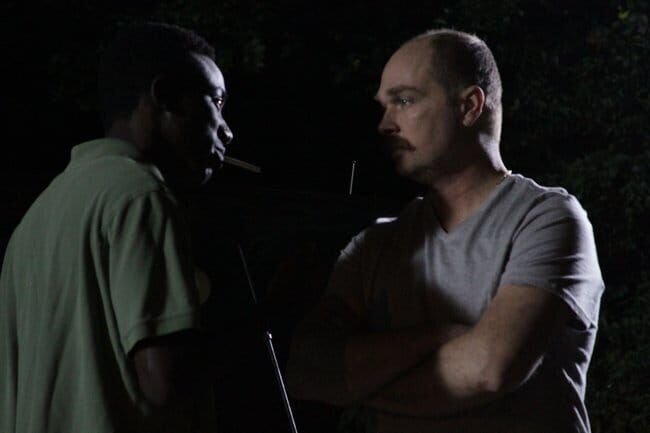 A recreation of Bernard talking to a Hatian man. – Bild: Discovery Communications