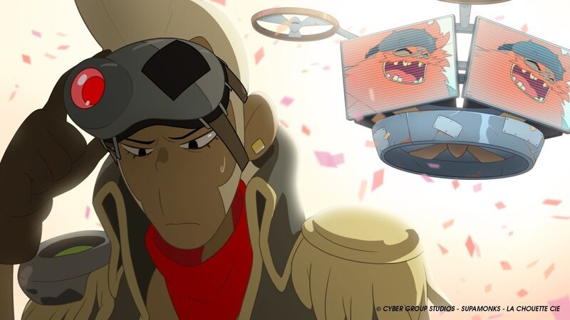 Shark von Team Pirates (l.) verliert einen Drohnenwettkampf gegen Kasskrane (im Bildschirm). – Bild: WDR/​2021 Cyber Group Studios