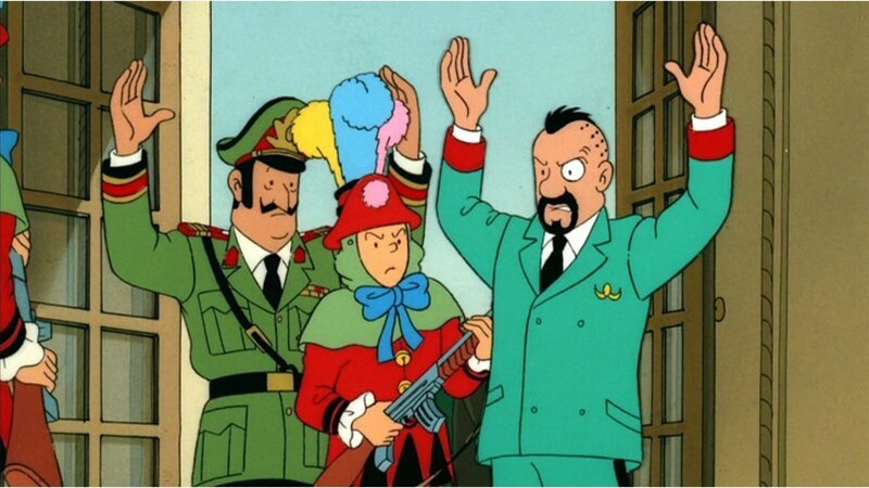 Tim (M.) überfällt an Karneval Oberst Sponsz (r.) und General Alvarez (l.) in Tapiocapolis, um entschlossen seinen riskanten Plan zu verfolgen. – Bild: ZDF und Ellipsanime/​France 3/​M6/​Nelvana