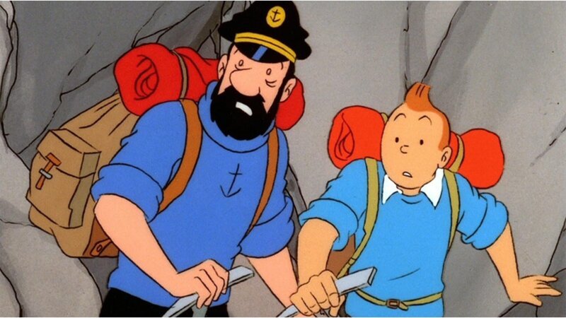 Tim (r.) und Kapitän Haddock (l.) suchen in den Bergen nach einem Freund, der bei einem Flugzeugabsturz ums Leben gekommen sein soll. Doch dann machen sie eine ungewöhnliche Entdeckung. – Bild: Ellipsanime/​France 3/​M6/​Nelvana